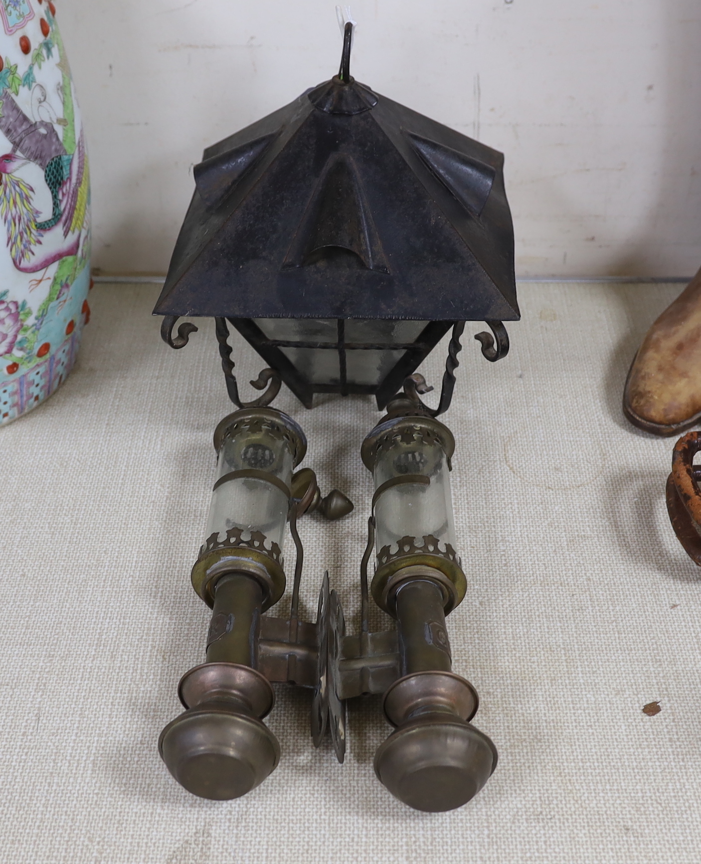 A pair of GWR railway lamps and a wrought iron hanging lantern, largest each 35cm high